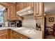 Kitchen featuring a white countertop, white tile backsplash, and stainless steel appliances at 2538 Anchors Way, Snellville, GA 30078