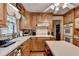 Kitchen featuring a stainless steel sink, stainless steel appliances, and hardwood floors at 2538 Anchors Way, Snellville, GA 30078