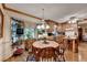 Eat-in kitchen features warm wood cabinets, a windowed breakfast nook, and an eat-in bar at 2538 Anchors Way, Snellville, GA 30078