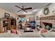 Inviting living room with brick fireplace, ceiling fan, and natural light at 2538 Anchors Way, Snellville, GA 30078