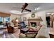 Bright living room with brick fireplace, hardwood floors, and comfortable seating at 2538 Anchors Way, Snellville, GA 30078