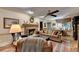 Cozy living room with a brick fireplace, comfortable seating, and natural light at 2538 Anchors Way, Snellville, GA 30078