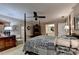 Comfortable carpeted main bedroom with decorative wallpaper and access to the bathroom at 2538 Anchors Way, Snellville, GA 30078
