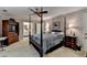 Spacious main bedroom featuring a four-poster bed, carpeted flooring, and elegant decor at 2538 Anchors Way, Snellville, GA 30078
