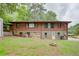 Brick back exterior showcasing a functional design and access to the outdoor space with potential for customization at 3336 Forrest Hills Dr, Hapeville, GA 30354