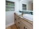 Bathroom featuring a granite-top double sink vanity with white vessel sinks, an LED mirror, and ample light at 3336 Forrest Hills Dr, Hapeville, GA 30354