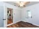 Cozy bedroom features hardwood floors, access to the kitchen, and natural light at 3336 Forrest Hills Dr, Hapeville, GA 30354