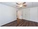 Bedroom featuring wood-look floors, a ceiling fan, and freshly painted white walls at 3336 Forrest Hills Dr, Hapeville, GA 30354