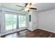 Spacious bedroom featuring large windows and hardwood floors at 3336 Forrest Hills Dr, Hapeville, GA 30354