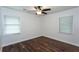 Bright bedroom features a ceiling fan, hardwood floors, and plenty of natural light at 3336 Forrest Hills Dr, Hapeville, GA 30354
