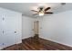Bedroom featuring a ceiling fan, hardwood floors, and a closet at 3336 Forrest Hills Dr, Hapeville, GA 30354