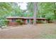 Charming brick ranch home with a bright blue front door and a well-maintained lawn at 3336 Forrest Hills Dr, Hapeville, GA 30354