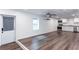 Spacious living area featuring wood floors, a stainless steel kitchen, and natural light at 3336 Forrest Hills Dr, Hapeville, GA 30354