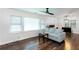 Bright living room features large windows, a comfortable sofa, and hardwood floors at 3336 Forrest Hills Dr, Hapeville, GA 30354