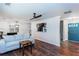 Open-concept living room features a comfortable sofa and an open kitchen area at 3336 Forrest Hills Dr, Hapeville, GA 30354