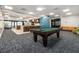Spacious game room featuring a pool table, breakfast bar and comfortable seating area at 620 Peachtree Ne St # 1001, Atlanta, GA 30308