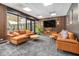 Relaxing lounge area with cozy seating, a large-screen TV, and stylish decor at 620 Peachtree Ne St # 1001, Atlanta, GA 30308