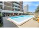 Outdoor pool and lounge area with comfortable seating and city views at 620 Peachtree Ne St # 1001, Atlanta, GA 30308