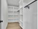 A custom closet boasts built-in shelving and ample hanging space at 830 Gaston Sw St, Atlanta, GA 30310