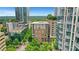 A vibrant urban setting showcasing modern high-rise buildings with lush greenery and city views at 867 Peachtree Ne St # 702, Atlanta, GA 30308