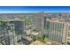 Stunning aerial view of the city skyline showcasing a modern building with surrounding greenery and urban landscape at 867 Peachtree Ne St # 702, Atlanta, GA 30308