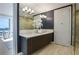Spa-like bathroom features dual sinks, a glass-enclosed shower, and contemporary fixtures at 867 Peachtree Ne St # 702, Atlanta, GA 30308