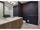 Modern bathroom with a sleek vanity, stylish wallpaper, and a glass-enclosed shower for a spa-like experience at 867 Peachtree Ne St # 702, Atlanta, GA 30308