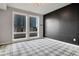 Modern bedroom featuring a large window with city views, and stylish flooring at 867 Peachtree Ne St # 702, Atlanta, GA 30308
