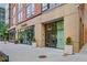 Modern building exterior featuring an entrance and storefronts including Starbucks and Capsule at 867 Peachtree Ne St # 702, Atlanta, GA 30308