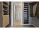Organized walk-in closet with custom shelving and drawers, providing ample storage space and bathroom view at 867 Peachtree Ne St # 702, Atlanta, GA 30308