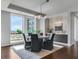 Dining area with table, chairs, modern lighting, and large window with city view at 867 Peachtree Ne St # 702, Atlanta, GA 30308