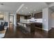 Sleek kitchen with dark wood cabinetry, stainless steel appliances, and a spacious island with seating at 867 Peachtree Ne St # 702, Atlanta, GA 30308