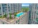 Beautiful rooftop pool with ample lounge seating and shaded pergolas in a high-rise setting at 867 Peachtree Ne St # 702, Atlanta, GA 30308