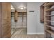 Spacious walk-in closet featuring custom shelving, drawers, and ample storage space at 867 Peachtree Ne St # 702, Atlanta, GA 30308