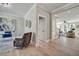 Bright foyer featuring a sitting area and views into the living room with gleaming hardwood flooring at 1679 Eastside Parc St, Atlanta, GA 30316