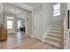 Entrance foyer featuring hardwood floors and a staircase leading to the upper level of the home at 1679 Eastside Parc St, Atlanta, GA 30316