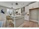 Contemporary kitchen featuring white cabinets, quartz countertops, and barstool seating at 1679 Eastside Parc St, Atlanta, GA 30316