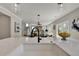 Open-concept kitchen with countertop island looking onto a modern dining and living area at 1679 Eastside Parc St, Atlanta, GA 30316