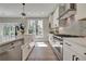 Bright, updated kitchen with stainless appliances, white cabinetry, and large sink at 1679 Eastside Parc St, Atlanta, GA 30316