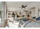 Spacious living room that opens to the kitchen and a staircase, featuring hardwood floors at 1679 Eastside Parc St, Atlanta, GA 30316