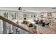 Open-concept living space with hardwood floors, ample natural light, and a modern kitchen at 1679 Eastside Parc St, Atlanta, GA 30316