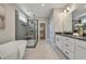Luxurious main bathroom with a soaking tub, walk-in shower, and modern finishes at 1679 Eastside Parc St, Atlanta, GA 30316