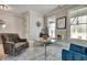 Light filled office with glass desk and stylish decor at 1679 Eastside Parc St, Atlanta, GA 30316