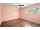 Bedroom with hardwood floors and ceiling fan at 1799 Harmony Rd, Powder Springs, GA 30127