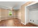 Comfortable bedroom with ample space, wood flooring, and natural lighting at 1799 Harmony Rd, Powder Springs, GA 30127