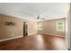 Spacious bedroom with hardwood floors and ceiling fan at 1799 Harmony Rd, Powder Springs, GA 30127