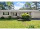 Charming one-story home with a covered front porch and well-maintained landscaping in a lush, green lawn at 1799 Harmony Rd, Powder Springs, GA 30127