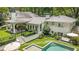 This backyard view shows the gorgeous pool, spa and patio with great outdoor seating at 3089 Marne Nw Dr, Atlanta, GA 30305