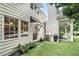 Charming outdoor grill and patio area extends off the house to artificial lawn space at 3089 Marne Nw Dr, Atlanta, GA 30305