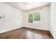 Bright bedroom featuring natural light from large windows and stylish wall sconces at 3089 Marne Nw Dr, Atlanta, GA 30305